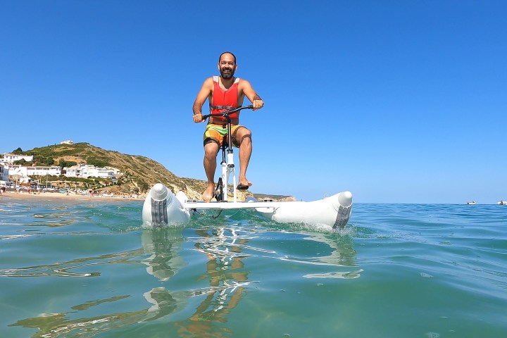 a man riding a surfboard in the water