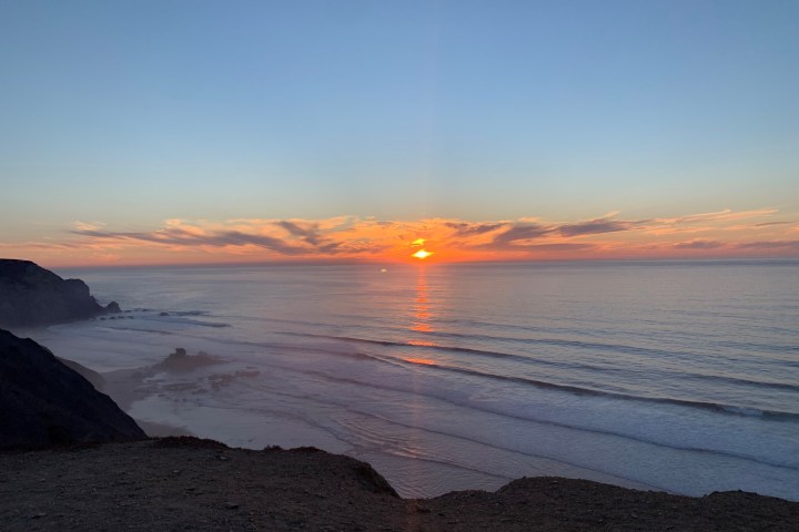 a sunset over a body of water